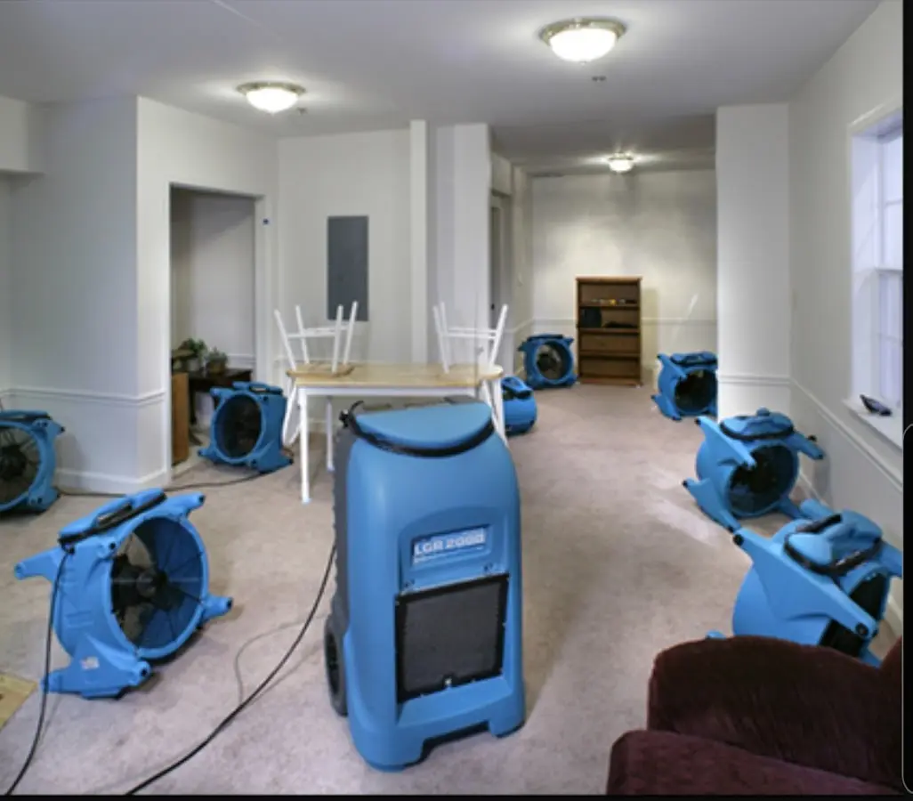 Air movers and dehumidifier setup for Water Damage Restoration in Hull